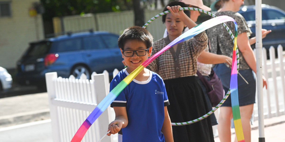 Children having fun and playing with ribbons on Hutt Street.