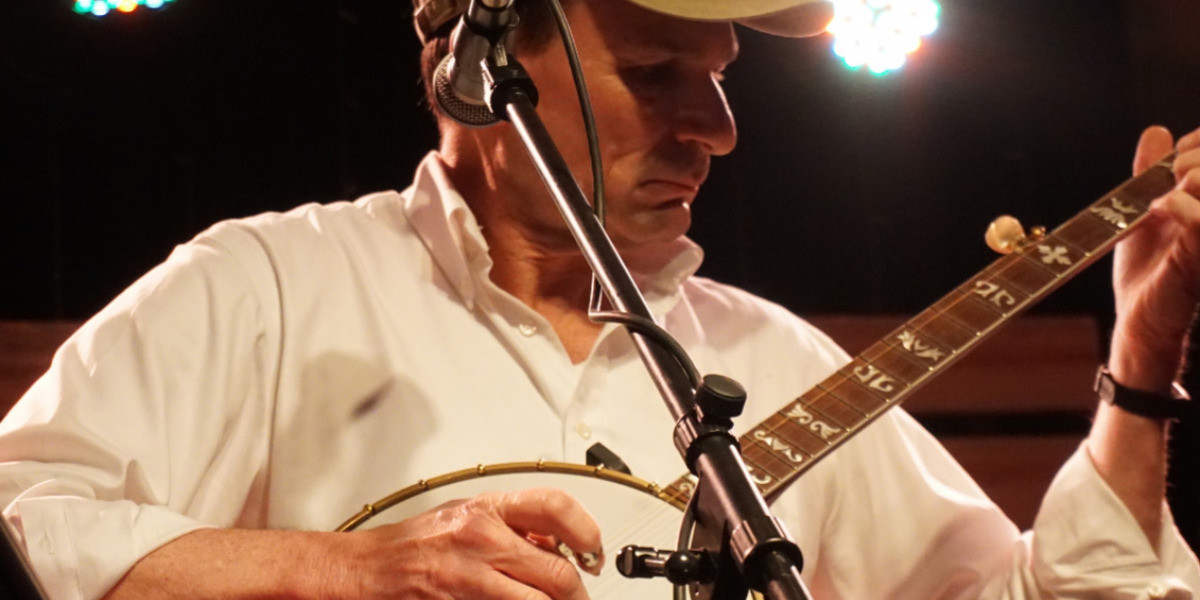 Performer, Keith Alessi, playing a Bluegrass banjo