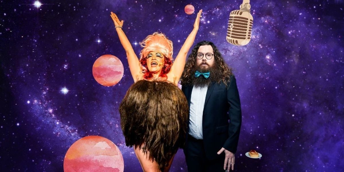 A lady wearing a giant dress made of hair holds her arms up in the air. A bearded man in a suit is with a bow tie in his beard and a pie with sauce next to him. The galaxy is behind them.