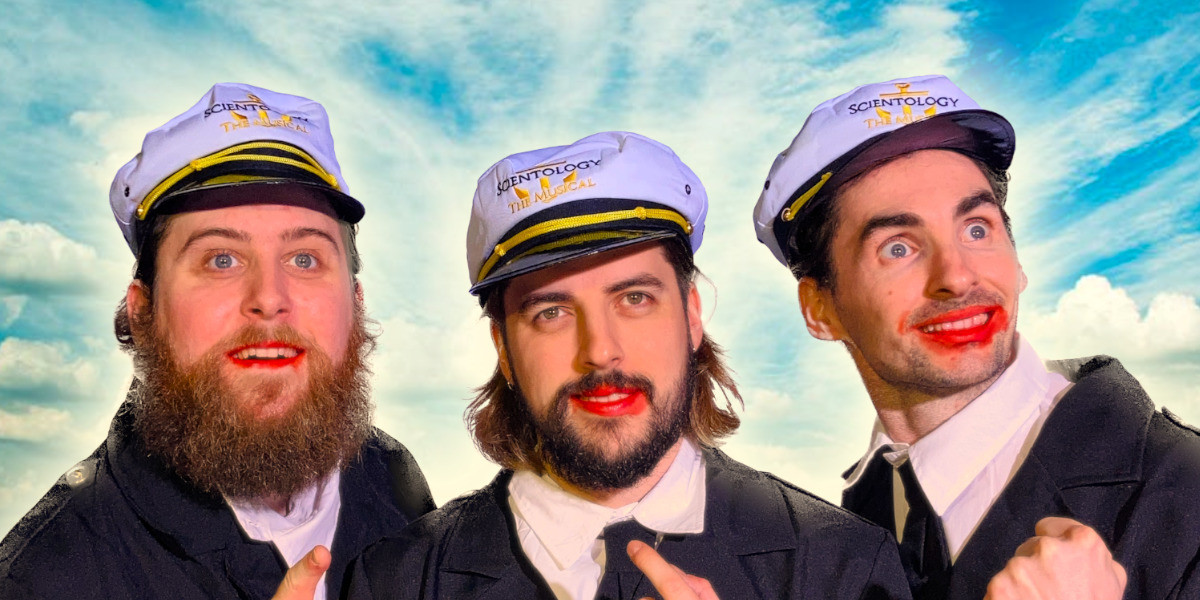 George Glass' Scientology The Musical - Three Scientologists in sailors outfits stare into the distance.Their lips are stained with red food dye from the red cordial they are drinking.