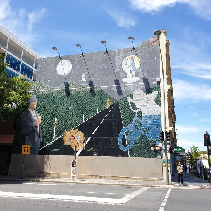 A mural on Frome Street depicting a man eating ice-cream and abstract designs.