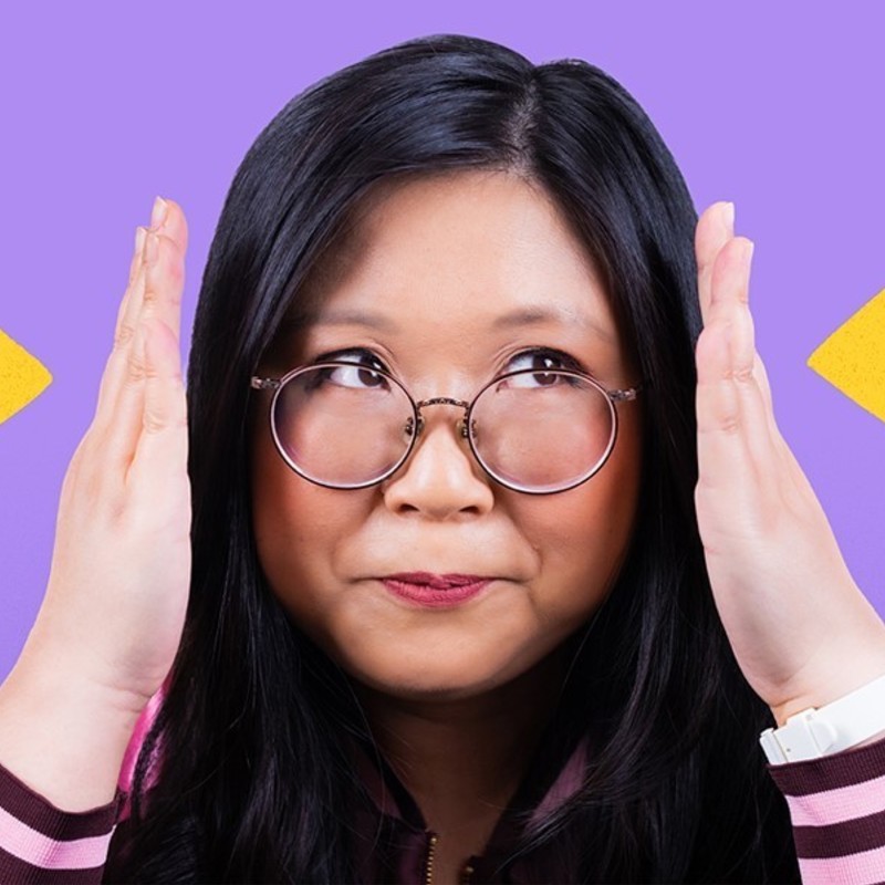 A Chinese woman looking up and right with a perplexed face, she has her hands up either side of here face, facing each other. The background is bright purple with large yellow arrows
