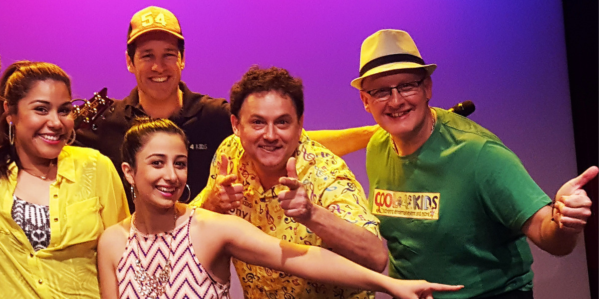 Members of Cool 4 Kids Music Makers band include Tony dressed in his bright yellow shirt filled with music notes and Nige dressed in a green Cool 4 Kids shirt