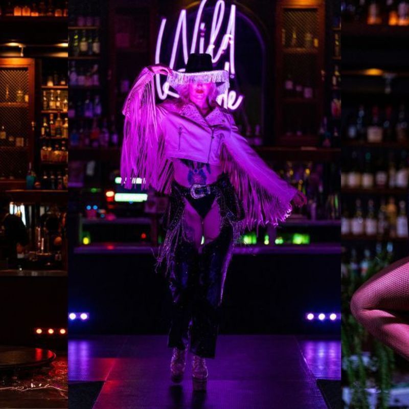 (Left) Cleo Rapture holds the pole and leans back and smiles at the audience against a backdrop of whiskey bottles on shelves with the purple 'Wild Side' sign.
(Centre) Hannah Indigo wears a black cowboy hat, pink fringe jacket and black chaps and walks up the stage against a backdrop of whiskey bottles on shelves with the purple 'Wild Side' sign.
(Right) Ali Pickup spins on a lyra and leans back smiling against a backdrop of whiskey bottles on shelves