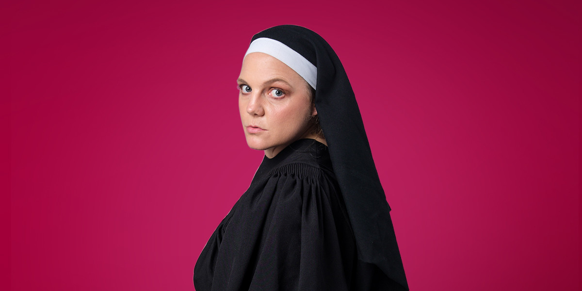 Nun Slut - Claire in front of a red background. They wear a nun's habit.
