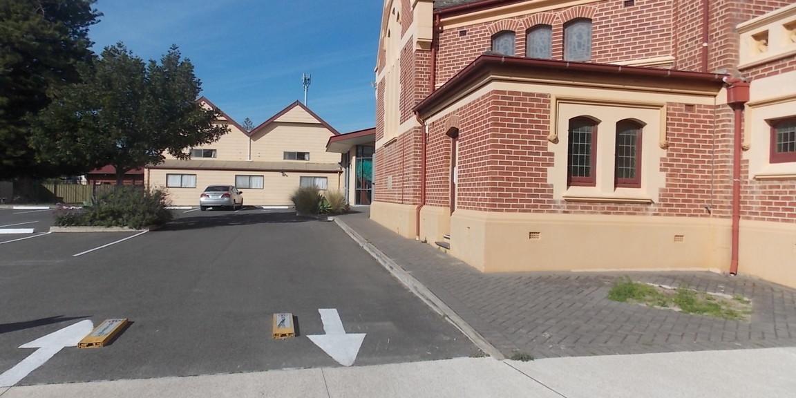 Drop Off point in car park - paved footpath connects directly to entry foyer.