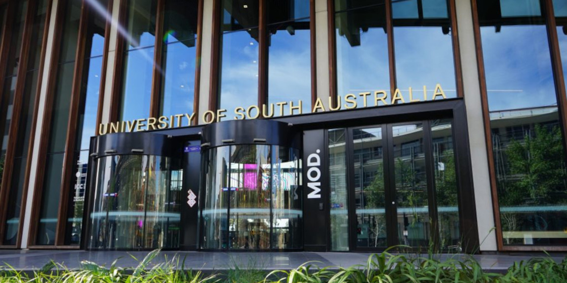 Two curved glass doors below a sign saying University of South Australia and MOD.